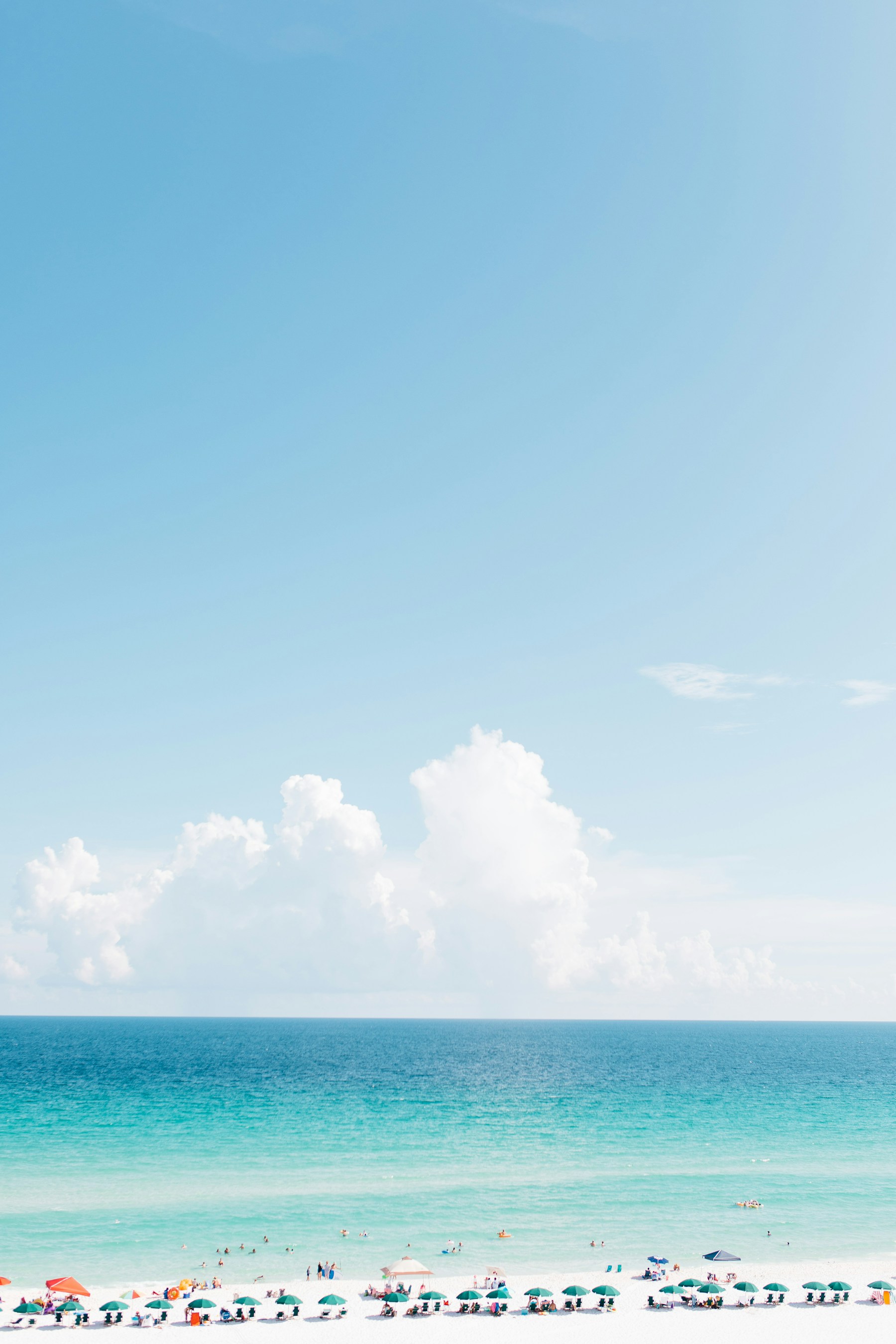 Turquoise Gulf water and white sand at Pensacola Beach