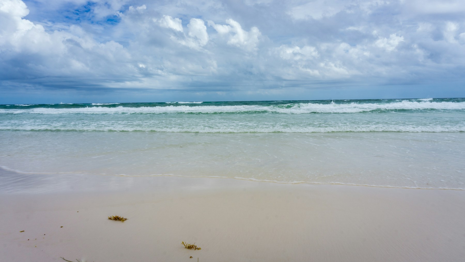 Waves on the white-sand shore at Henderson Beach in Destin