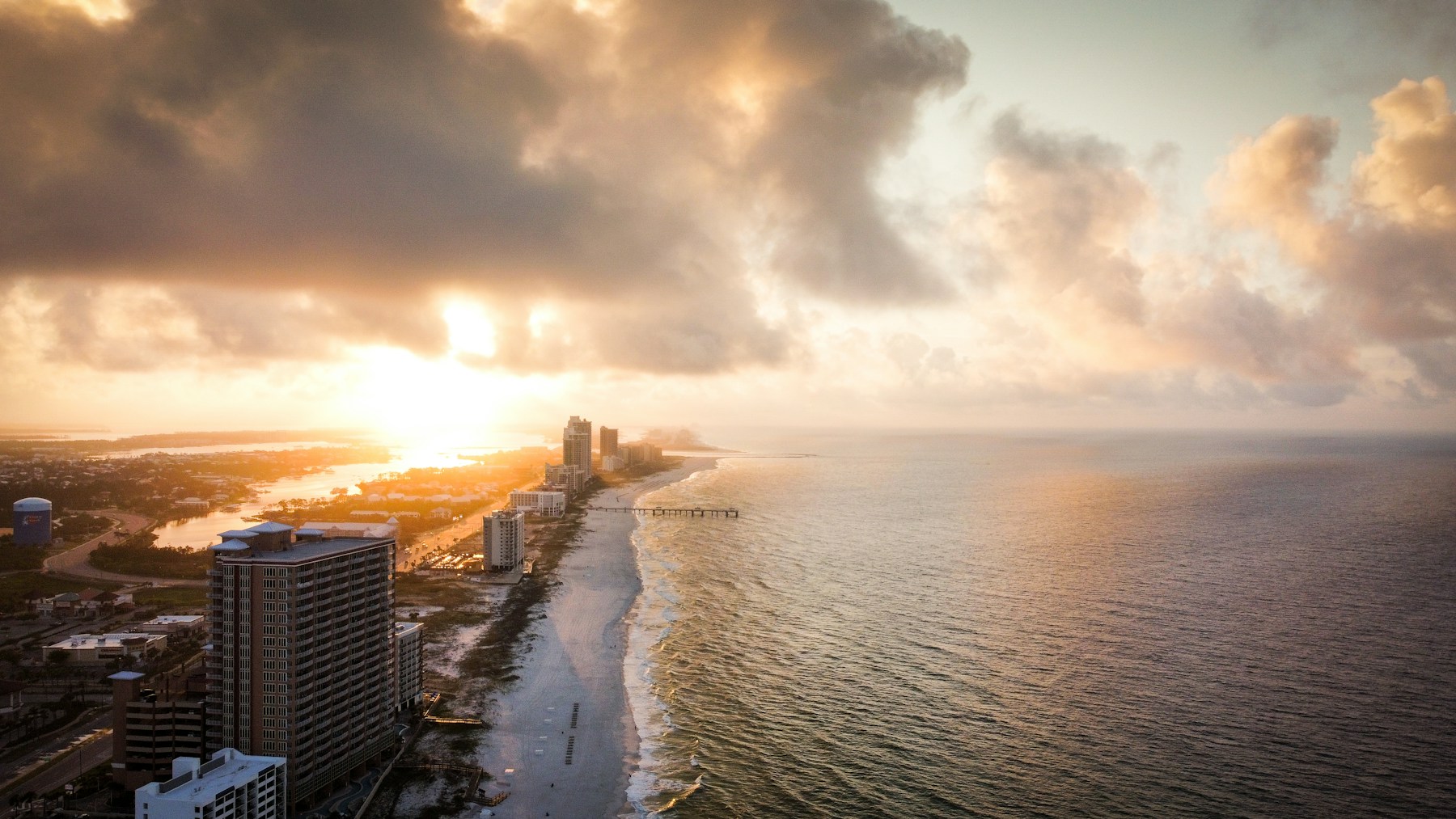 Orange Beach shoreline glowing at sunset